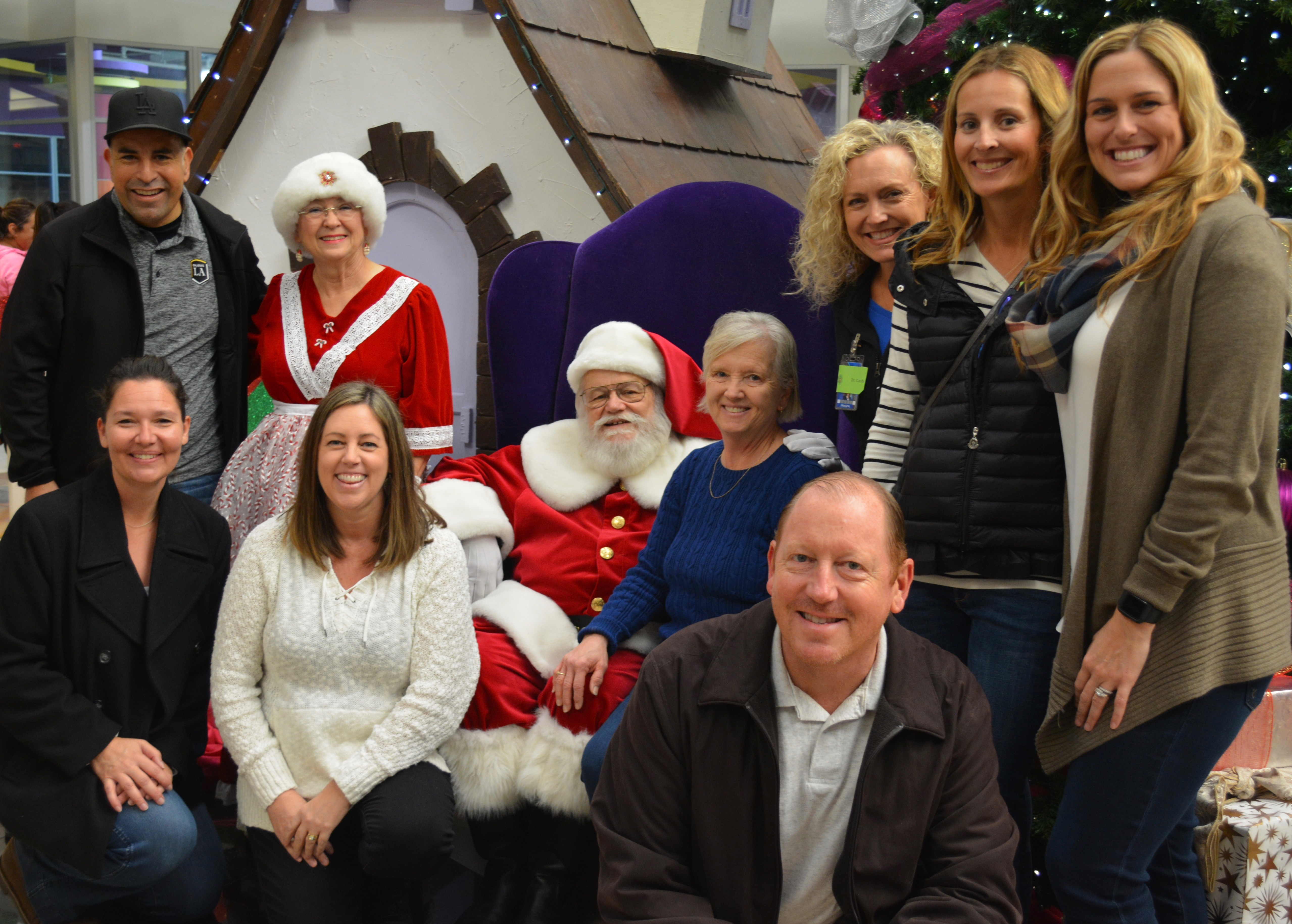 Apple Savanna's Administrators Visit with Santa at the Buena Park Shopping Spree. Apple