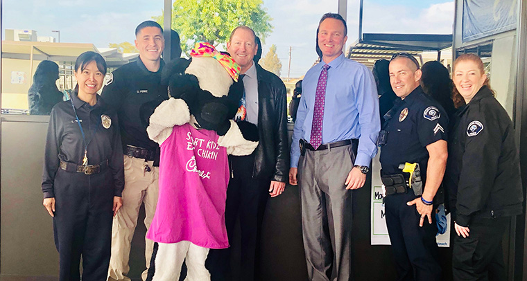 Principal with Buena Park Police officers and Millie Moo